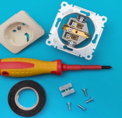 Tools electrician – screwdriver, screws, socket, electrical tape Tools electrician - screwdriver, screws, socket, electrical tape. Banner, copyspace.